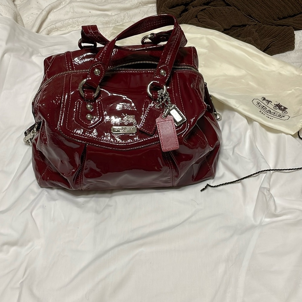 New coach purse.  Never been used.  Dark red shinny leather.